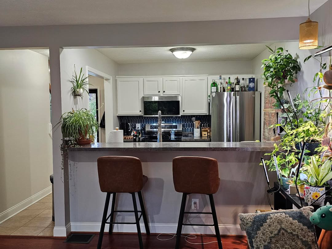 Kitchen with navy picket tile backsplash